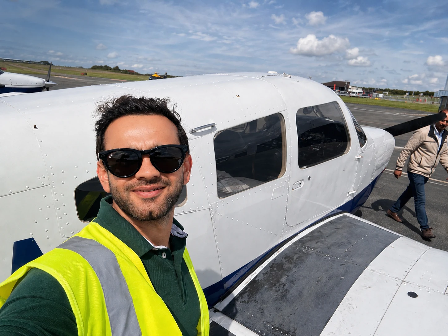 Vinamra next to an aircraft